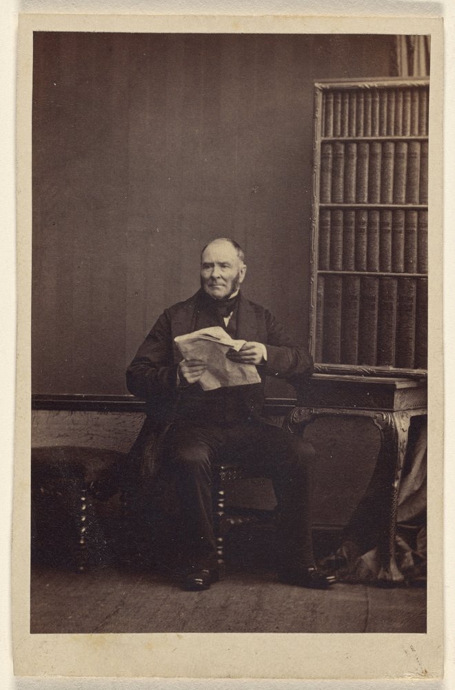 [Ongeïdentificeerde man zittend, met een krant in de hand]. door Camille Silvy
