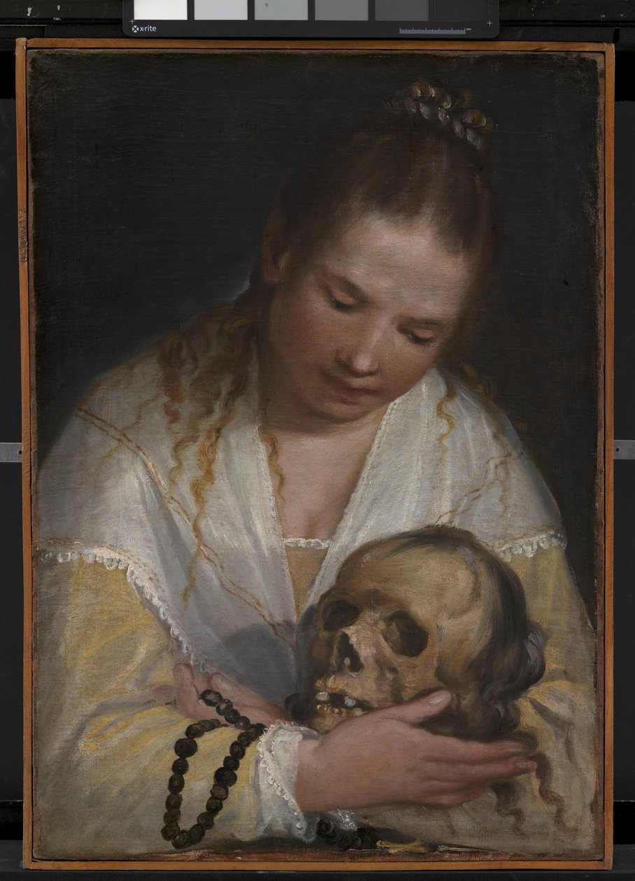Een jonge vrouw die een schedel overpeinst door Alessandro Casolani