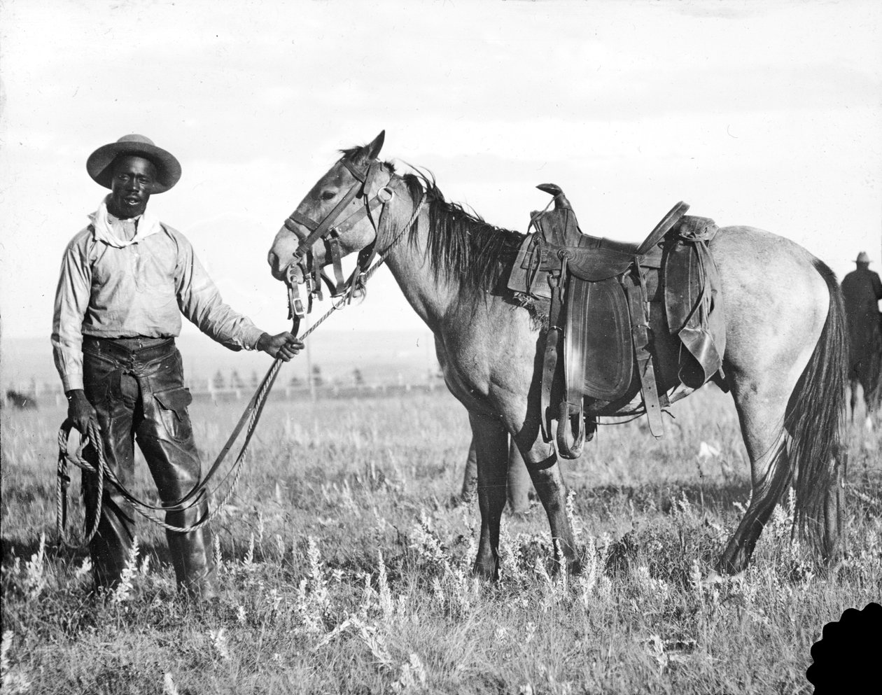 Zwarte cowboy en paard, c.1890-1920 door American Photographer