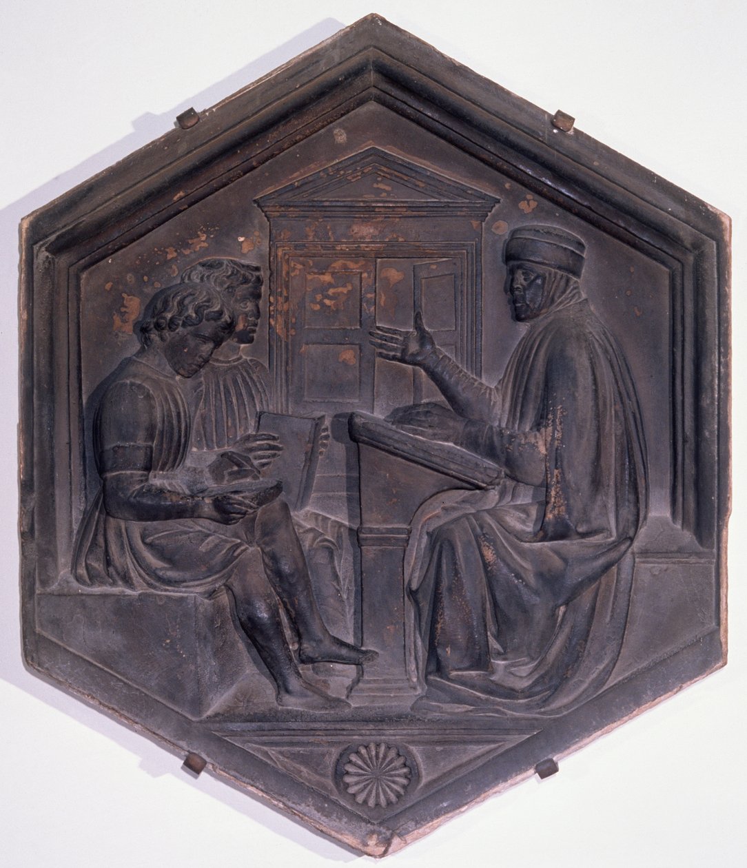 Grammatica, zeshoekige decoratieve tegel uit een serie die de Zeven Vrije Kunsten uitbeeldt, mogelijk gebaseerd op ontwerpen van Giotto, c.1334-48 door Andrea Pisano