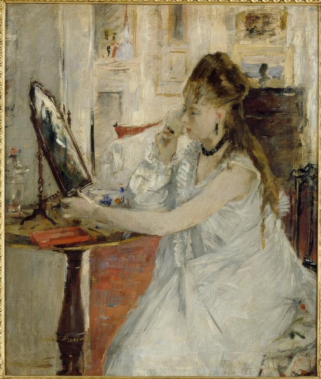 Jonge vrouw die zich poedert door Berthe Morisot