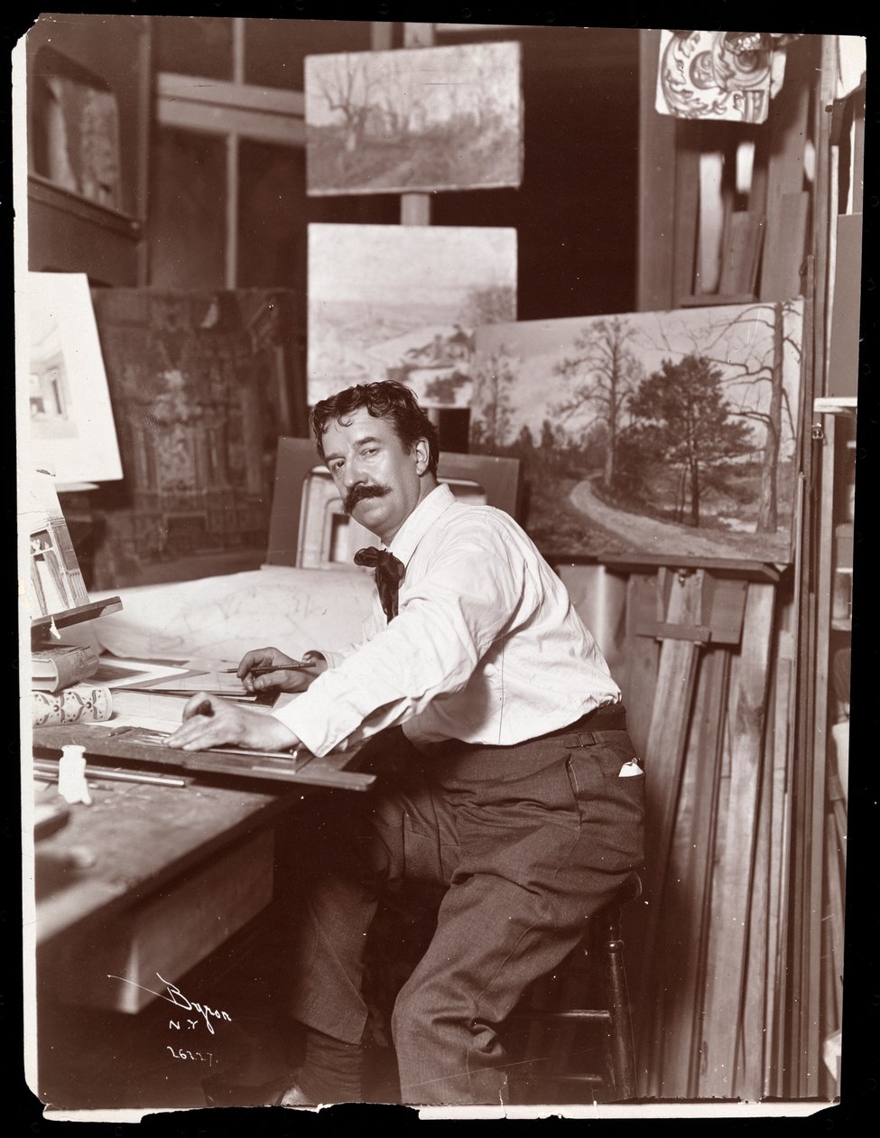Portret van Ernest Gross, decorontwerper, zittend in zijn studio aan zijn tekentafel, 1908-9 door Byron Company