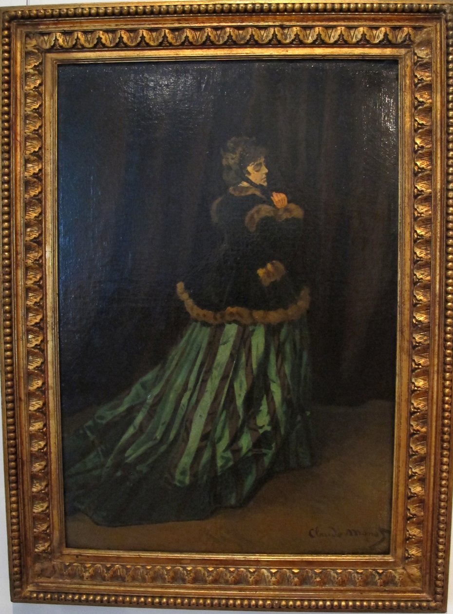 Camille in groene jurk door Claude Monet