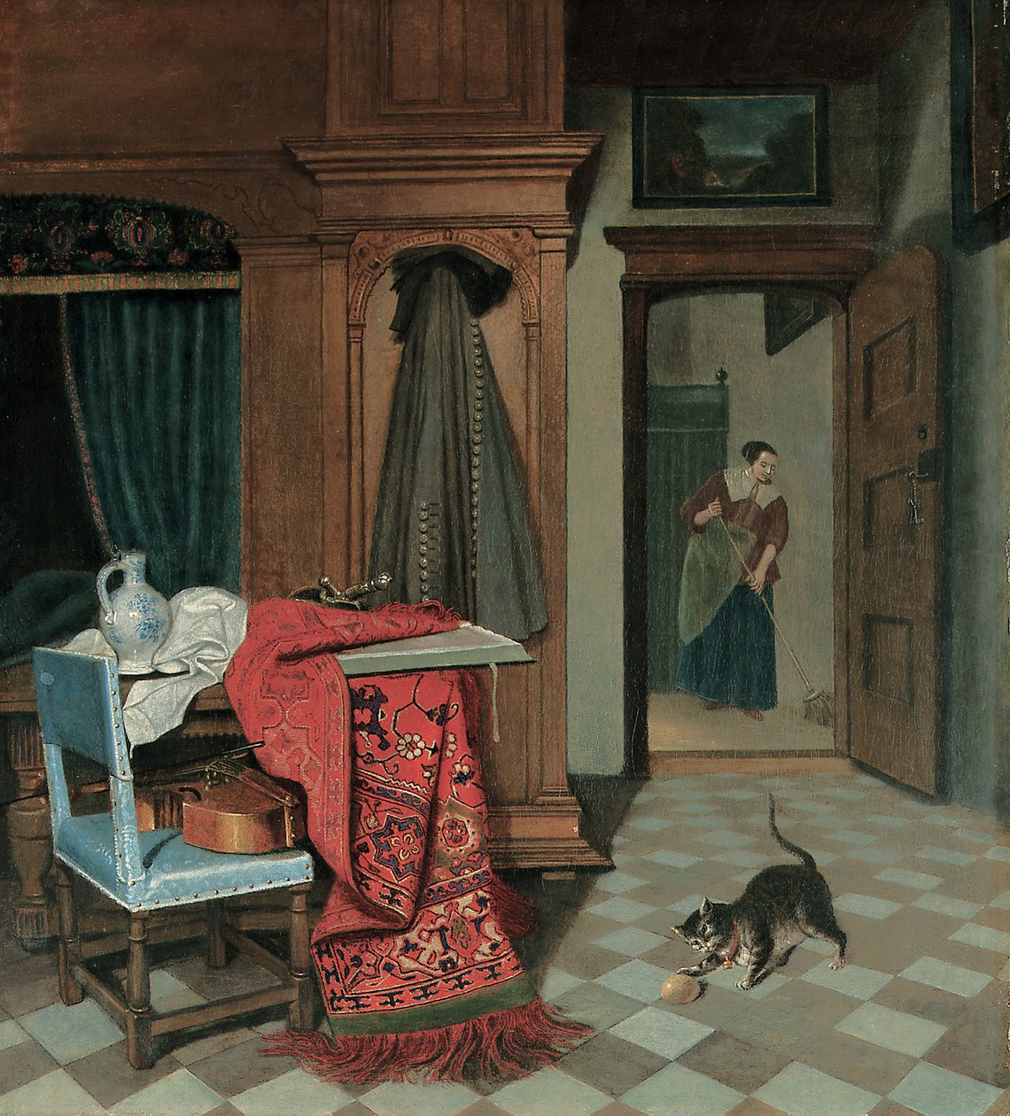 Interieur met een tapijt, een zwaard en een kruik op een tafel, een cello op een stoel, een jas aan een kast, een kat die met een bal speelt, een dienstmeid verderop door Cornelis de Man