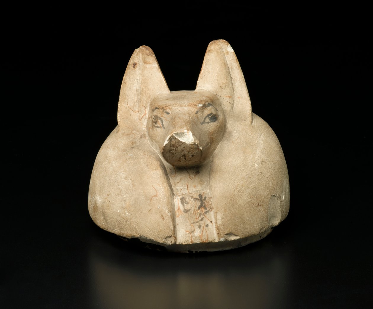 Jakhalskopdeksel van een canopische kruik door Egyptian