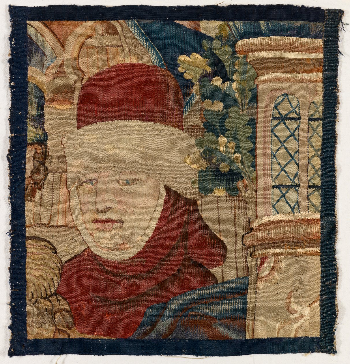 Klein wandtapijtfragment dat het hoofd van een man uitbeeldt, laat 15e eeuw door Franco Flemish School
