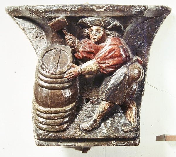 Misericord uit een koorbank die een man afbeeldt die een vat hamert, uit de Kerk van Saint-Etienne des Tonneliers, Rouen door French School