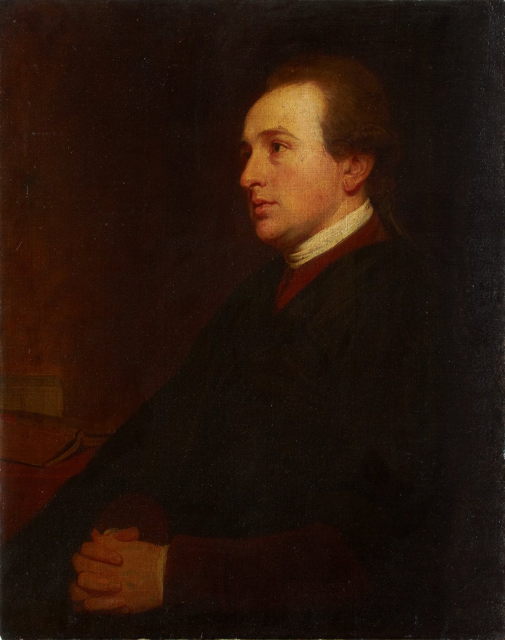 Portret van een jonge man aan zijn bureau door George Romney