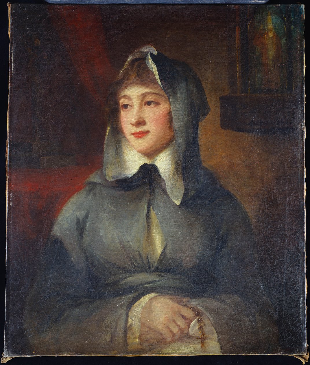 Portret van een dame, halve lengte, als non, met een rozenkrans, bij een schrijn in een interieur door George Romney