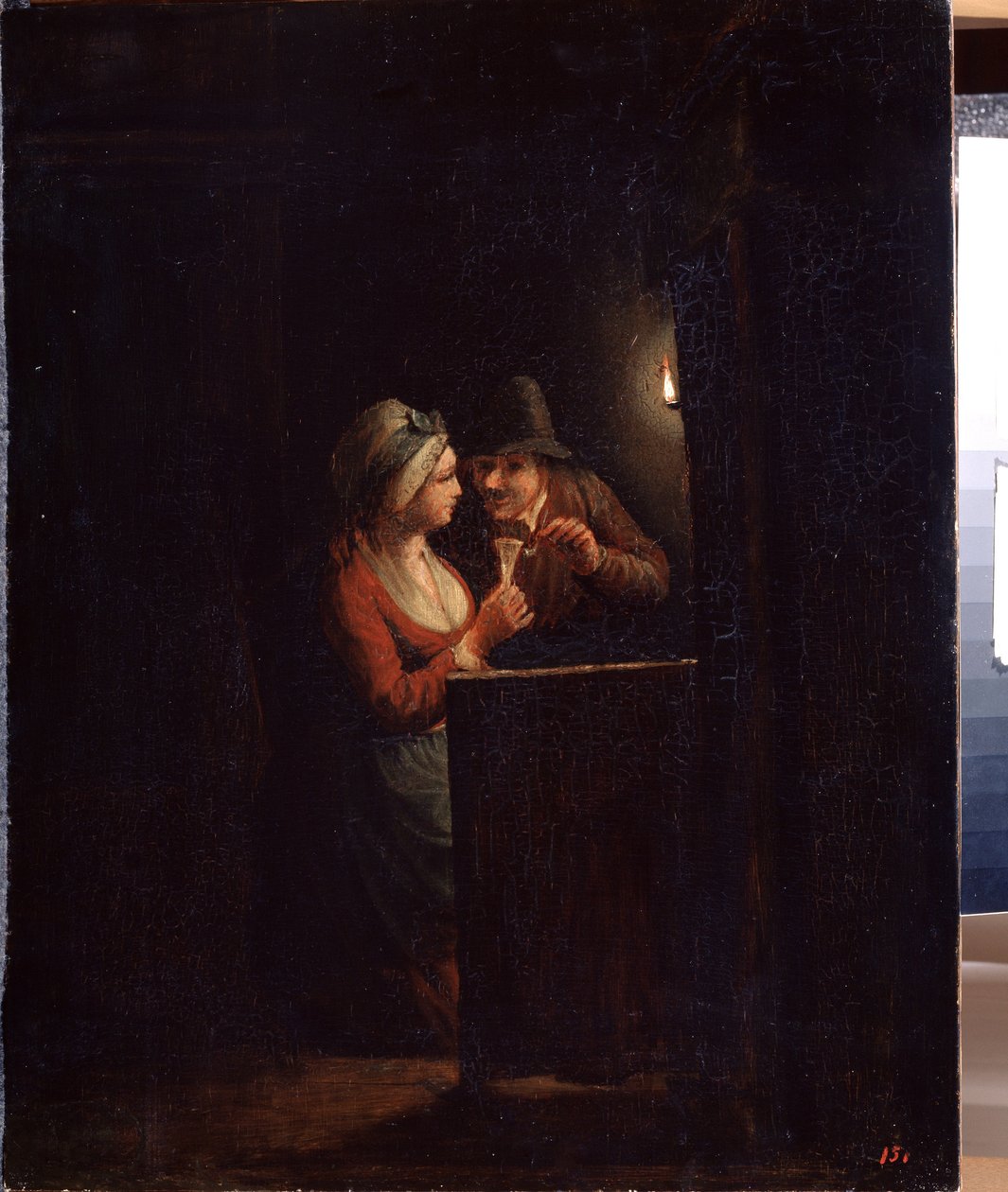 Een man en een vrouw bij kaarslicht door Godfried Schalcken