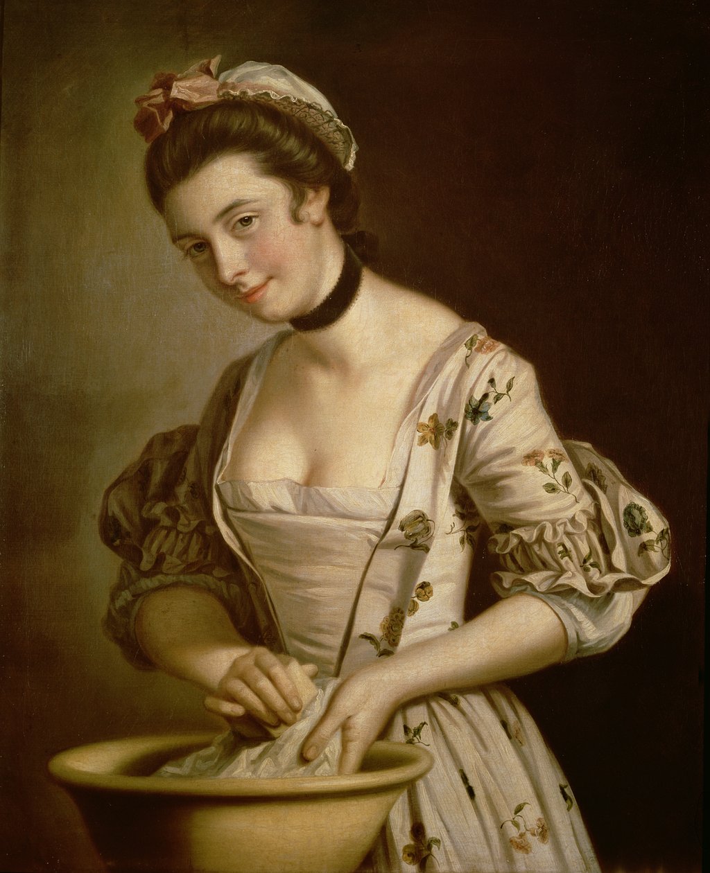 Een dienstmeisje die linnen zeept door Henry Robert Morland