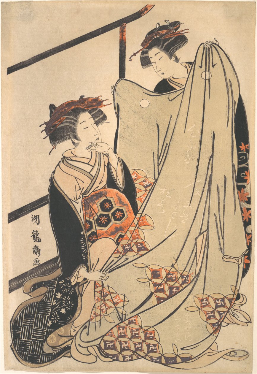 Twee schoonheden die naar een kimono kijken door Isoda Koryusai