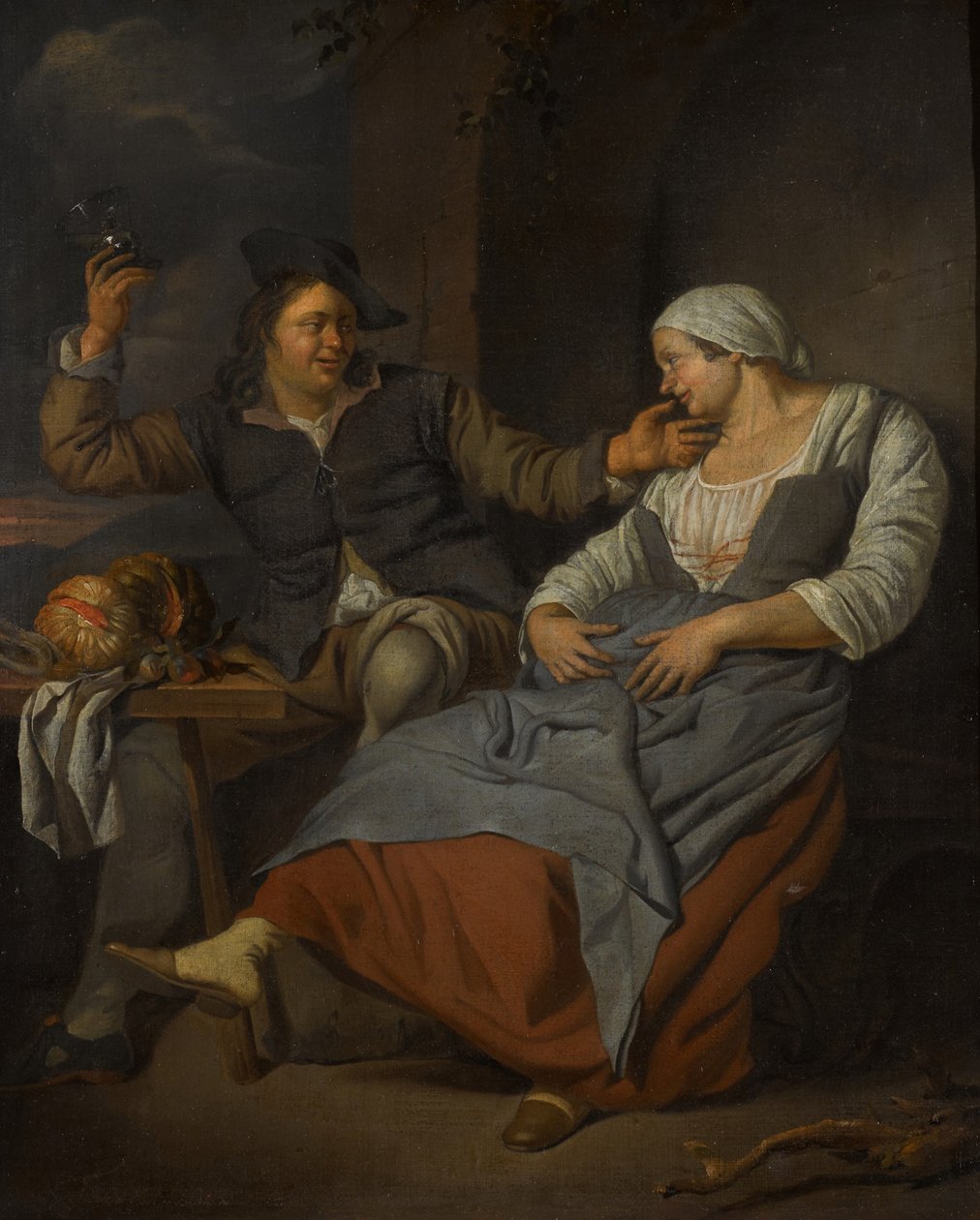 Een zittend echtpaar drinkt wijn door Jacob Toorenvliet