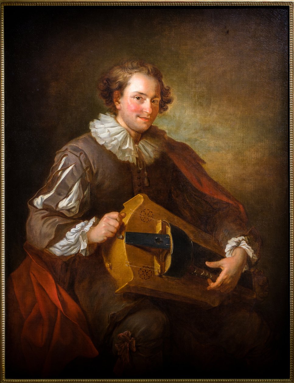 Portret van een draailierspeler door Jean Alexis Grimou