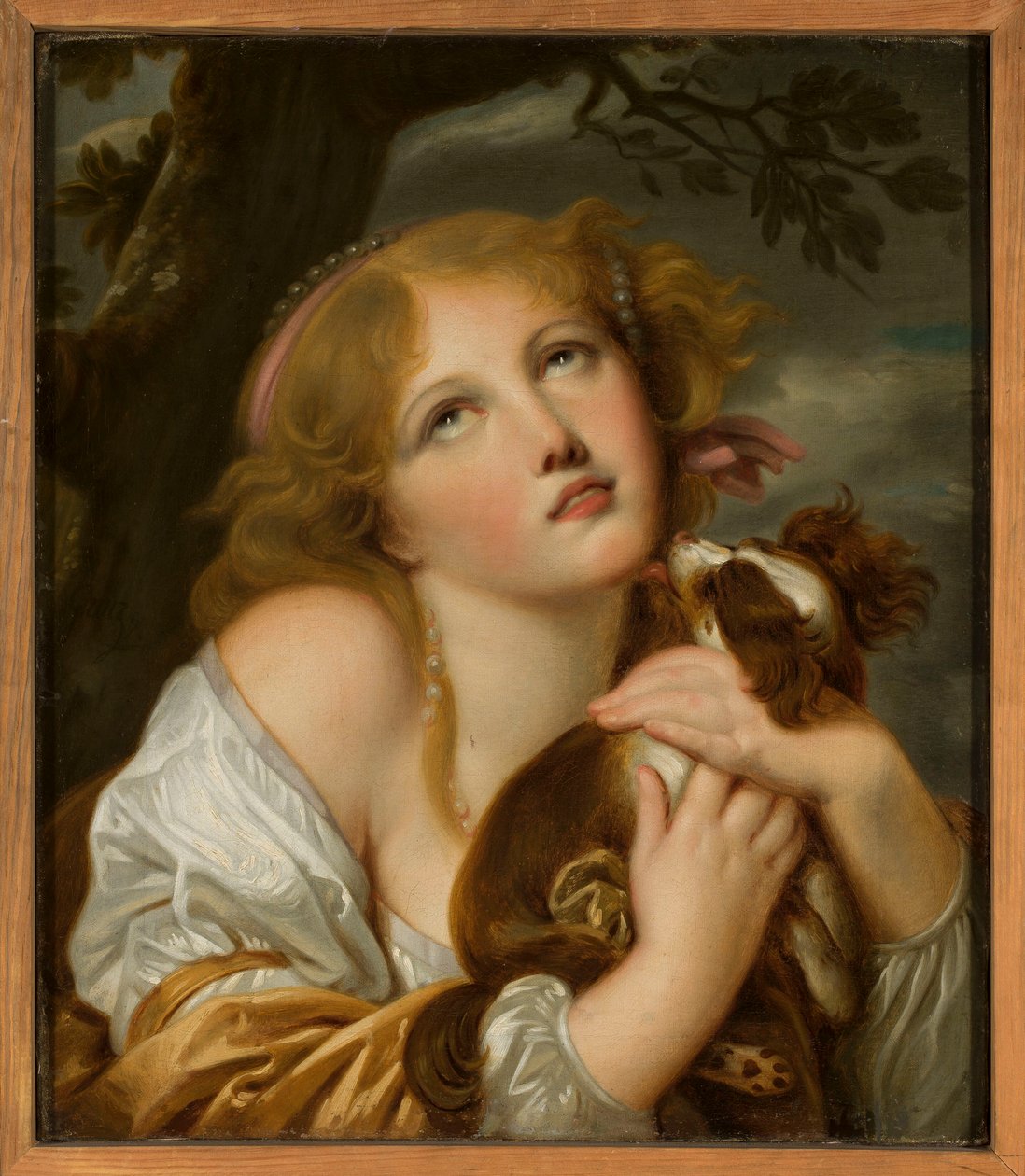 Meisje met een hond in haar armen door Jean-Baptiste Greuze