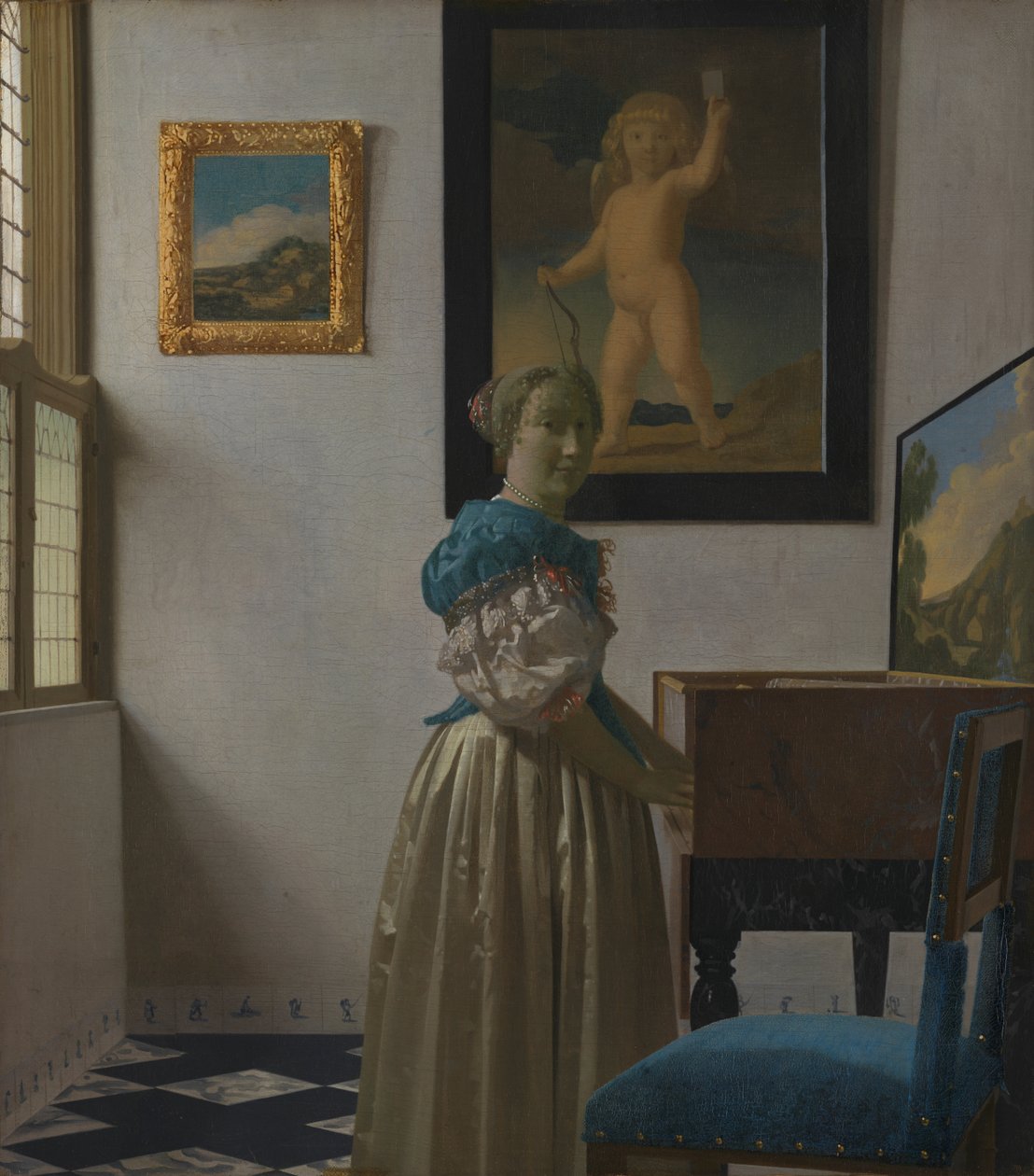 Eine junge Frau an einem Virginal door Johannes Vermeer