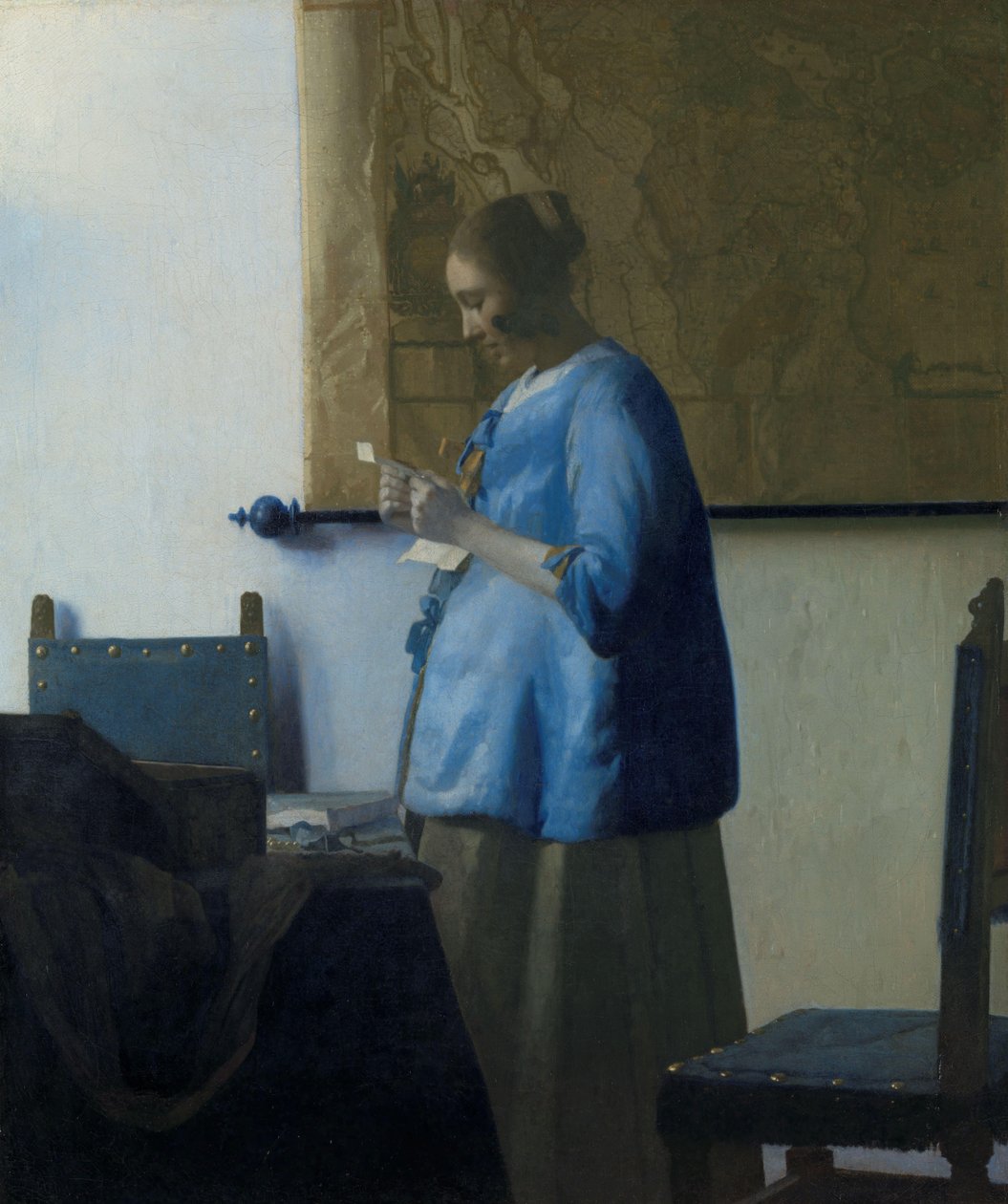 Vrouw in blauw die een brief leest door Johannes Vermeer