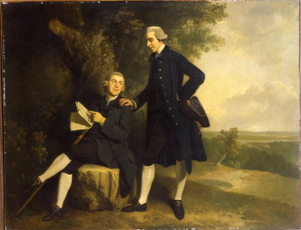 Dubbelportret van Thomas Somers Cocks en Richard Cocks van Castleditch, Beiden Klein Volledig, de Eerste in een Blauwe Jas en Vest met een Zwarte Driekantige Hoed, de Laatste Zittend in een Blauwe Jas en Vest met een Manuscript, in een Landschap door John Hamilton Mortimer