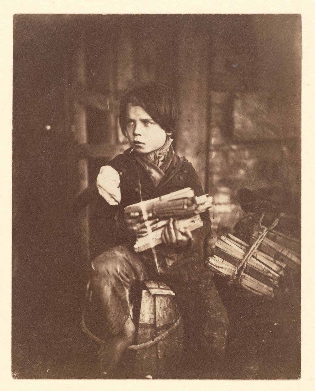 De kleine houtverkoper door John Thomson