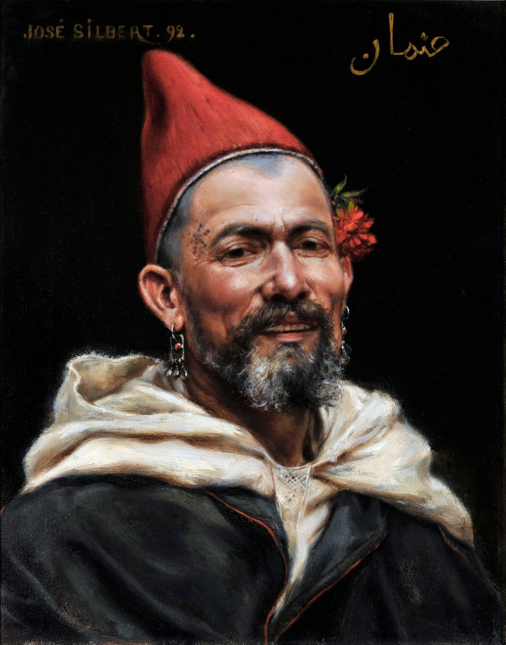 Hoofd van Marokkaan (Portret van man met doorboorde oren en rode hoed, met een bloem in het oor en een tatoeage op de slaap, 1892) door Jose Silbert