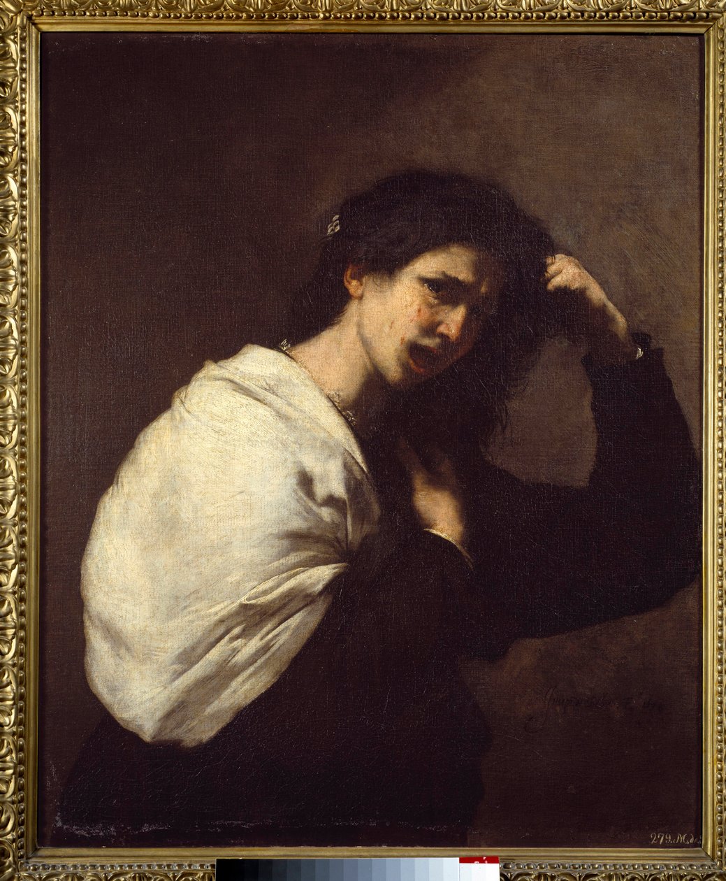 Vrouw die haar haar uittrekt door Jusepe de Ribera