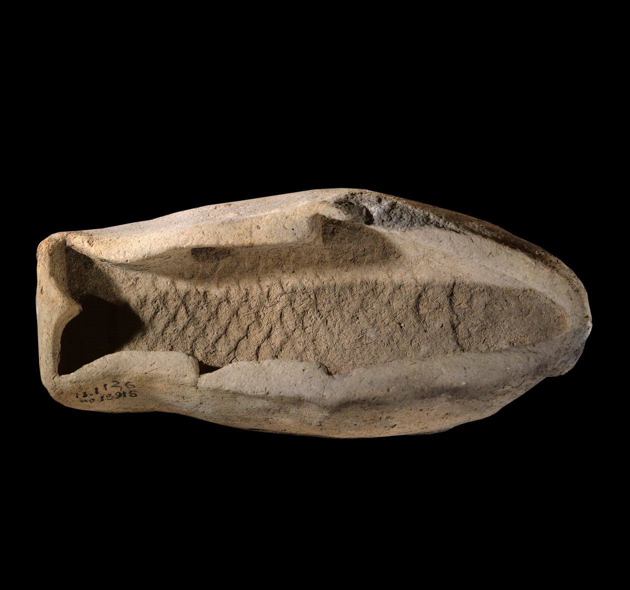 Terracotta mal in de vorm van een vis door Mesopotamian
