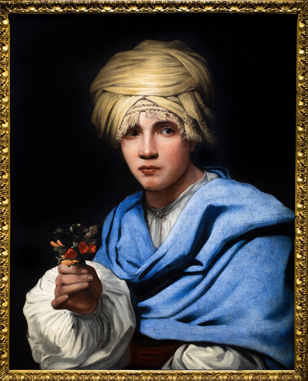 Jongen met tulband die een boeket bloemen vasthoudt door Michael Sweerts