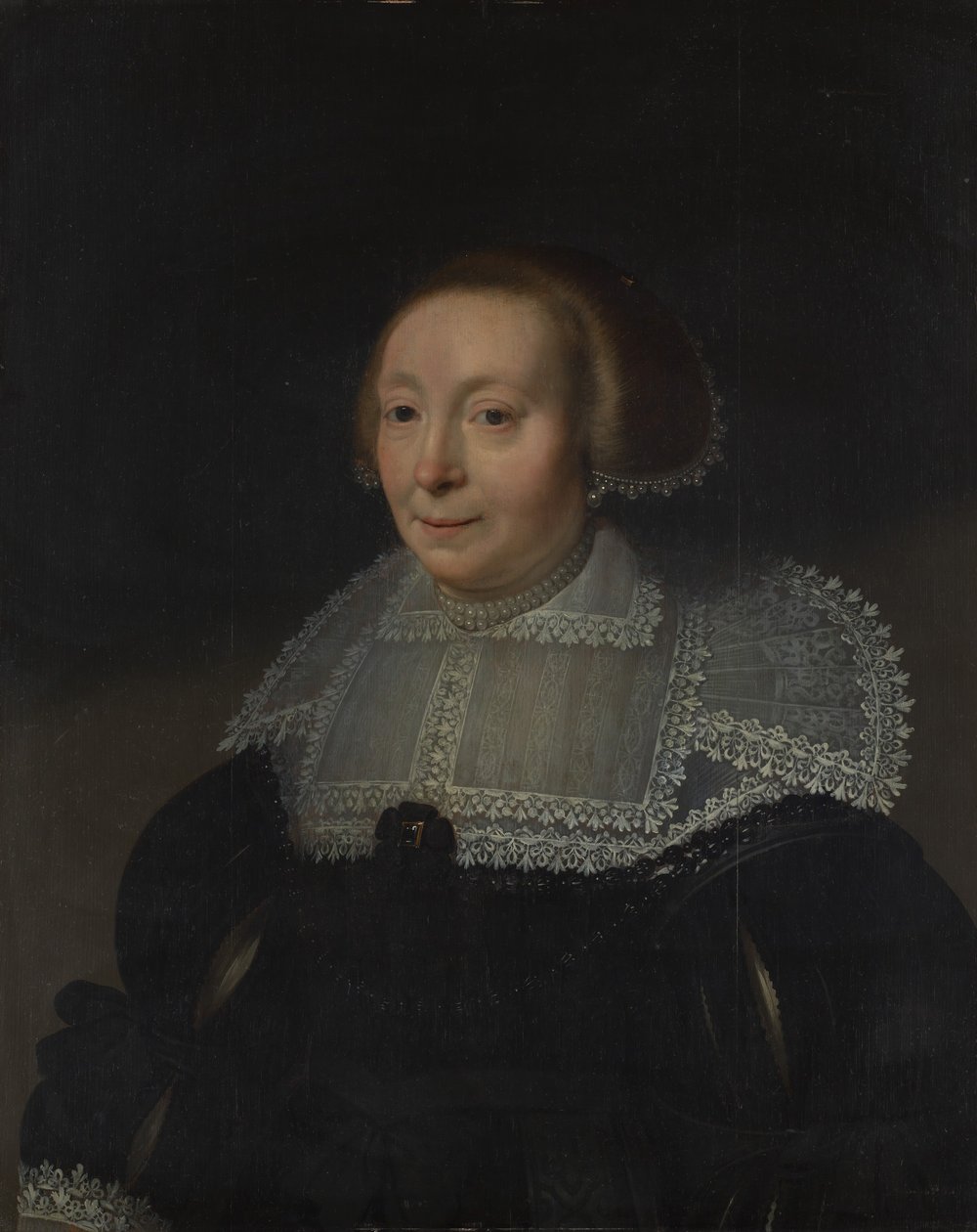Portret van een vrouw met een kanten kraag door Michiel Jansz van Mierevelt