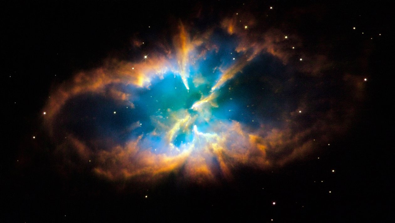 Planetaire nevel NGC 2818 in het zuidelijke sterrenbeeld Pyxis (Het Kompas). Gloeiende lagen en gasmantel werden gecreëerd toen een ster zijn buitenste lagen in de ruimte wierp na het opraken van nucleaire brandstof. door National Aeronautics and Space Administration National Aeronautics and Space Administration