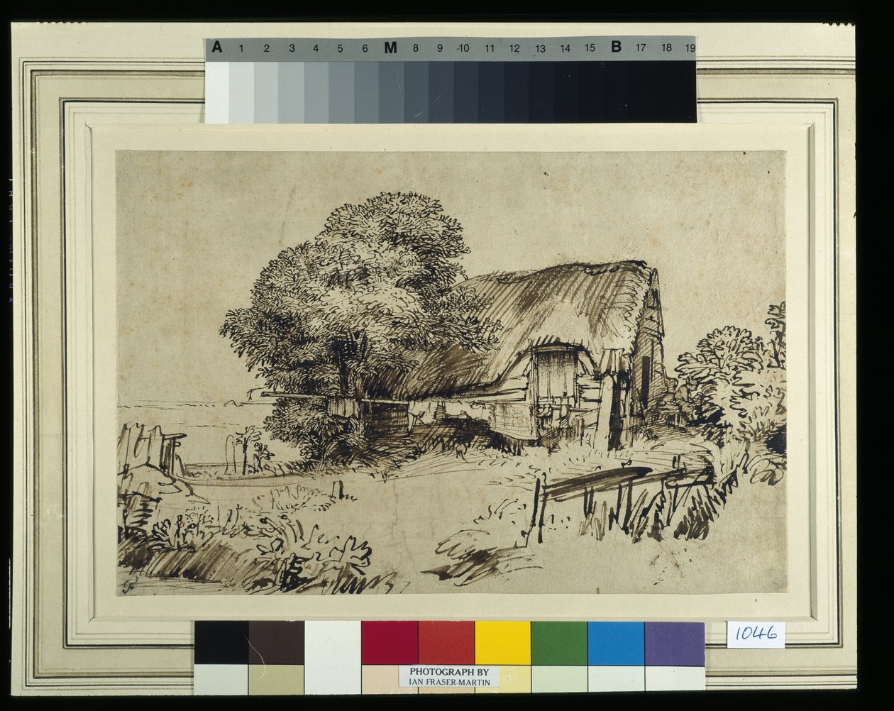 Een huisje met rieten dak bij een grote boom, een figuur zittend buiten, ca. 1648-52 door Rembrandt Harmensz. van Rijn