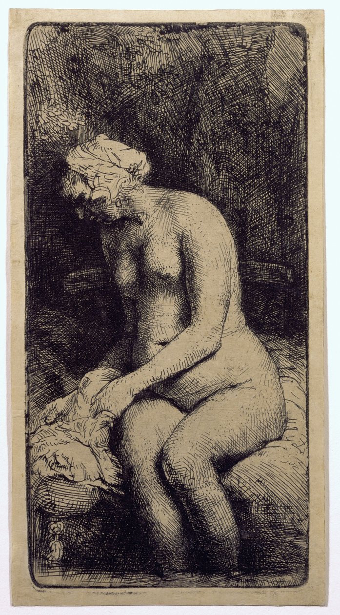 Een vrouw die haar voeten baadt in een beek door Rembrandt van Rijn