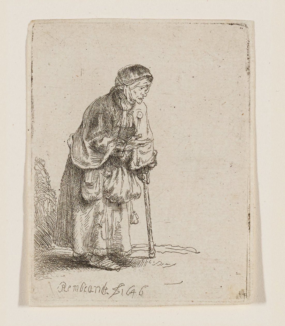 Bedelende vrouw leunend op een stok door Rembrandt van Rijn