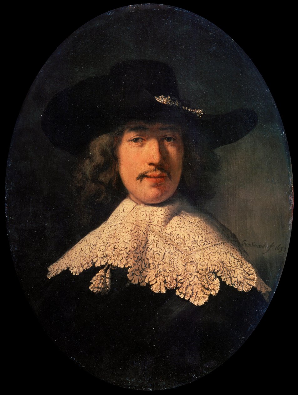 Portret van een jonge man met een kanten kraag door Rembrandt van Rijn