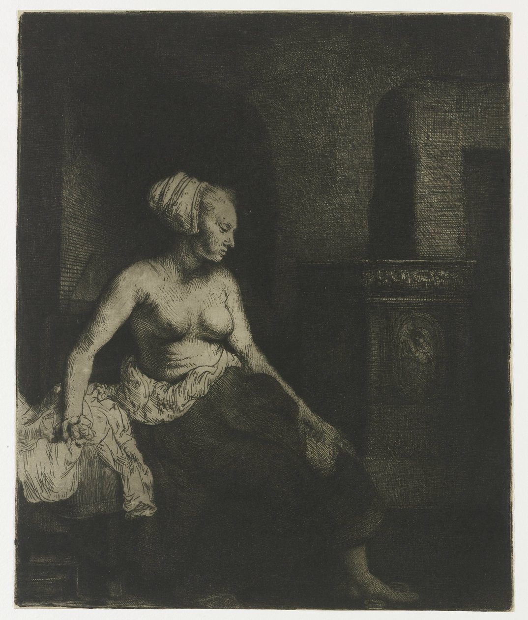 Zittende vrouw half gekleed naast een kachel door Rembrandt van Rijn