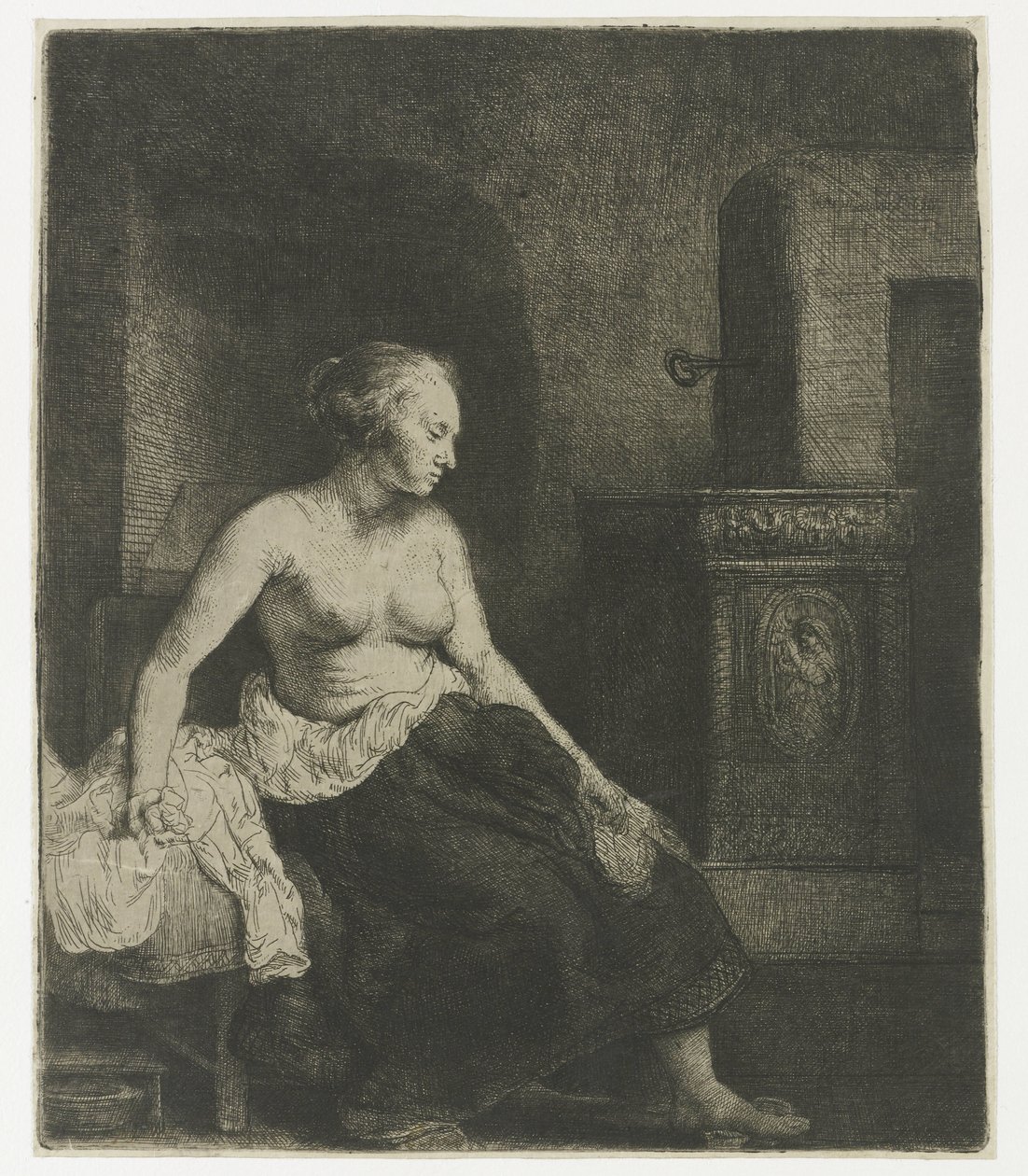 Vrouw zittend half aangekleed naast een kachel door Rembrandt van Rijn