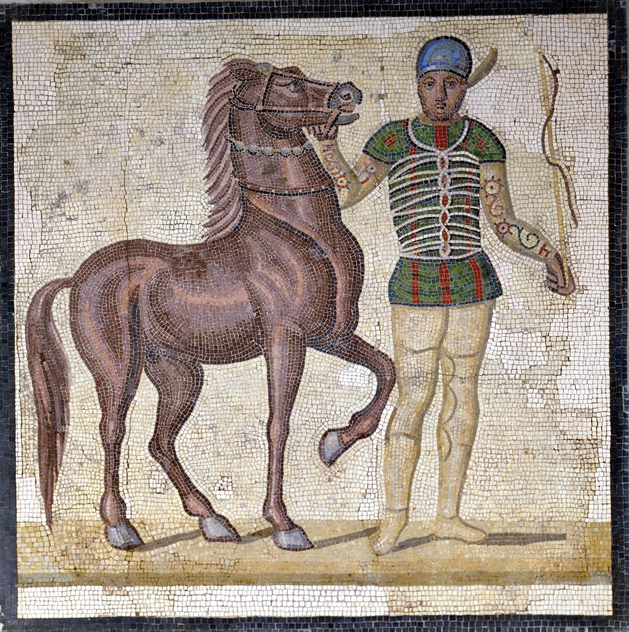 Representatie van de vier facties van het Romeinse circus: de Groenen (factio prasina). De facties waren clubs die deelnamen aan circuswedstrijden in het Hoge Rijk (1e eeuw na Chr.) en gekenmerkt werden door een kleur. Mozaïek, Rome Museo nazionale Romano. door Roman