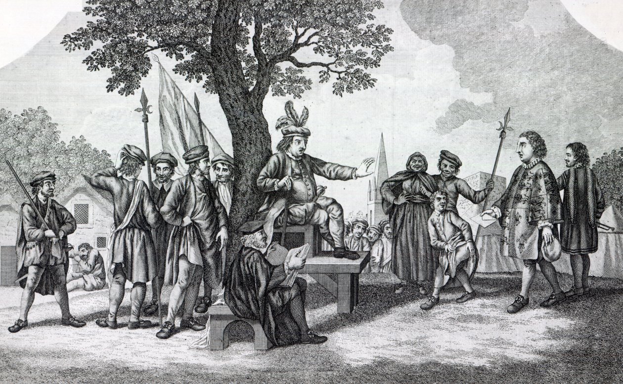 Robert Kett zittend onder de 