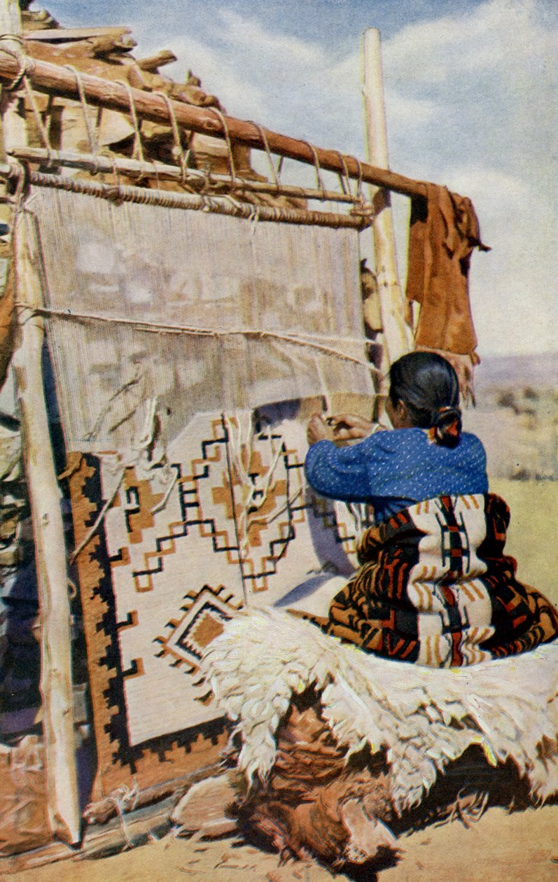 Arizona. In het hart van de woestijn van Arizona worden Navajo-dekens geweven, waarvan de schoonheid en bruikbaarheid veel klanten aantrekken. 1920 door Unknown