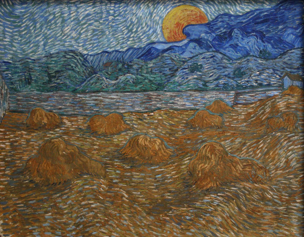 Landschap met korenschoven en opkomende maan door Vincent van Gogh