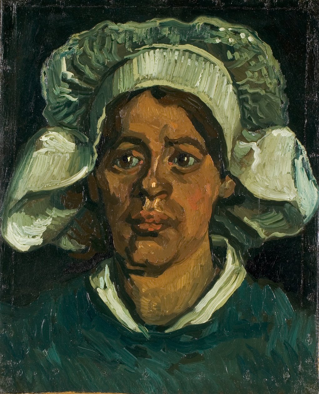 Hoofd van een boerin met een witte kap, 1884-1885 door Vincent van Gogh