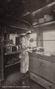 Chef aan het werk in L en NW Dining Car (zwart-wit foto) door (after) English photographer
