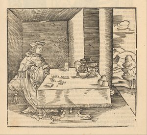 Man met kaarten en dobbelstenen aan tafel