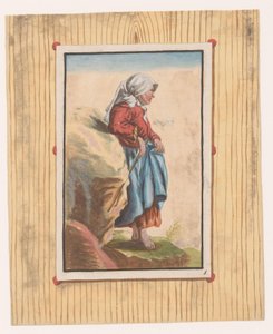 Staande vrouw met blote voeten en stok