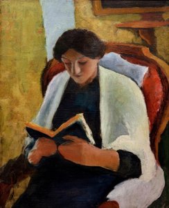 Lezende vrouw in rode stoel door August Macke