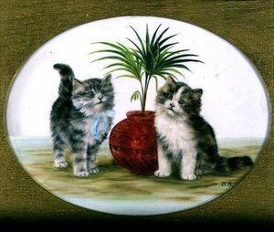 Kittens bij een Palm in een Kom