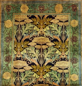 Een Donegal wollen tapijt met een bloemmotief door Charles Francis Annesley Voysey