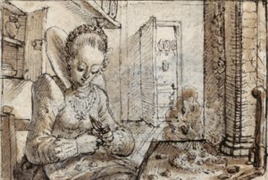 Een modieuze jonge vrouw zit aan een keukentafel om walnoten te pellen