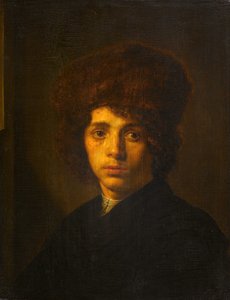 Jonge man met een bontmuts