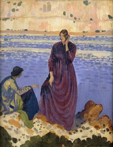 Twee vrouwen op rotsen bij de zee