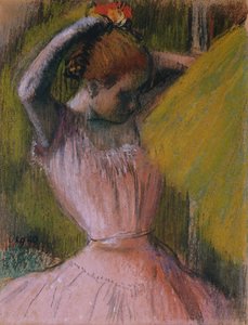 Danseres die haar haar arrangeert, ca. 1900-1912 door Edgar Degas